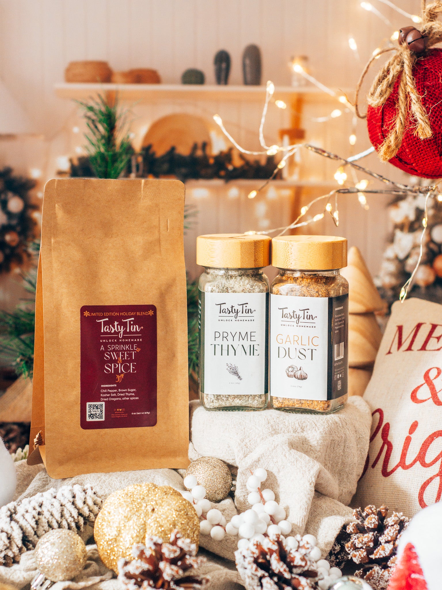 Tasty Tin spice products on a festive background with Christmas decorations