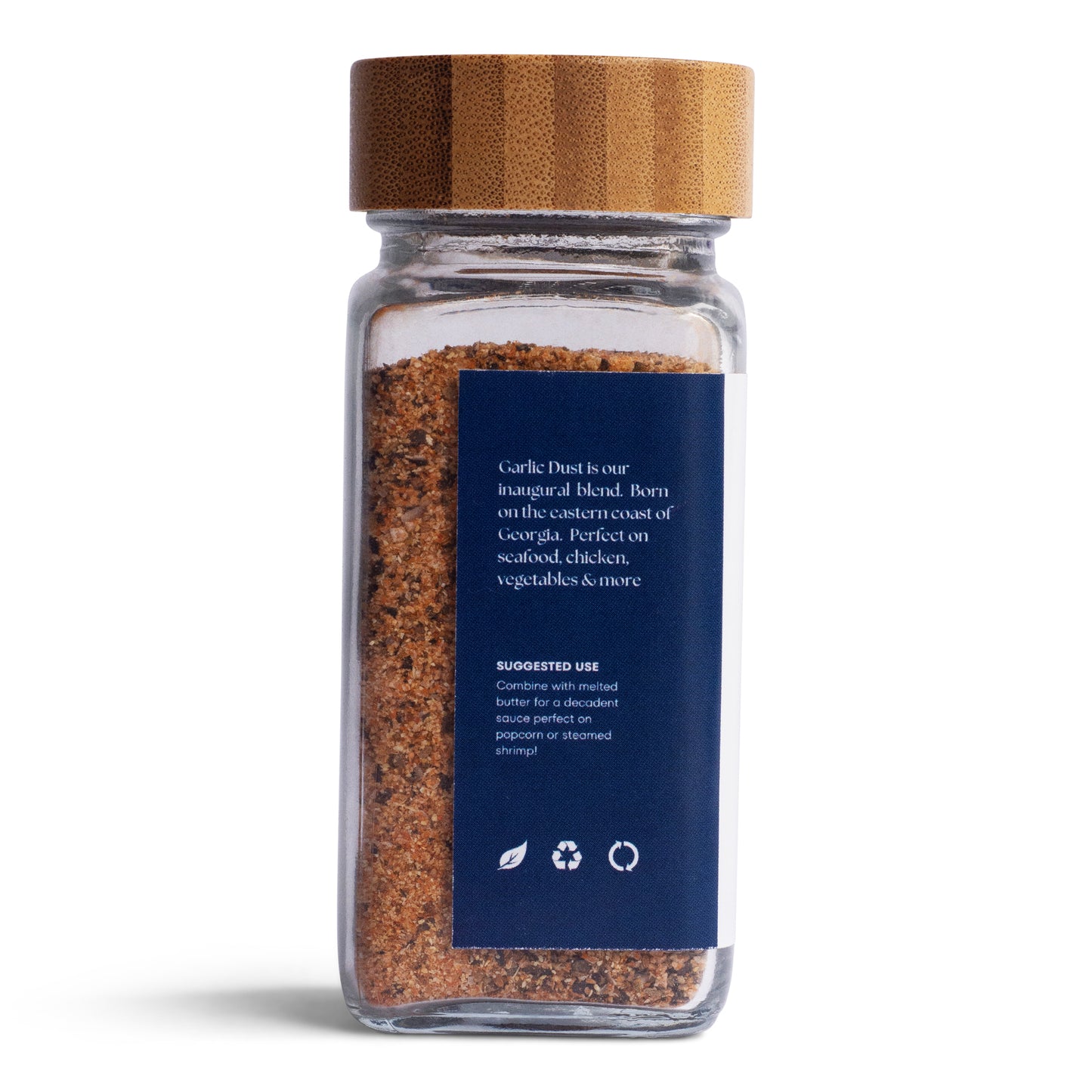 Tasty Tin garlic dust seasoning shaker with bamboo lid and blue label showing blend details