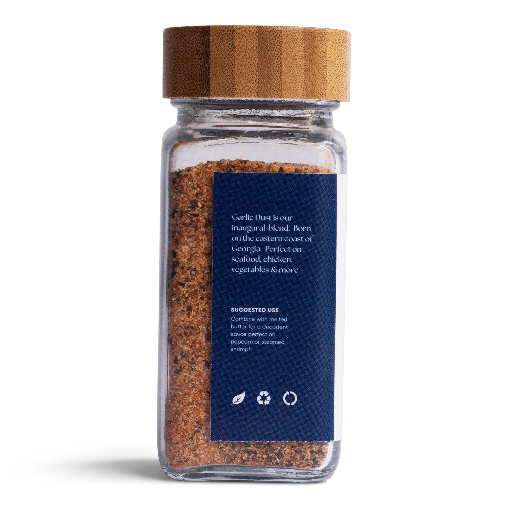 Tasty Tin garlic dust seasoning shaker with bamboo lid and blue label showing blend details