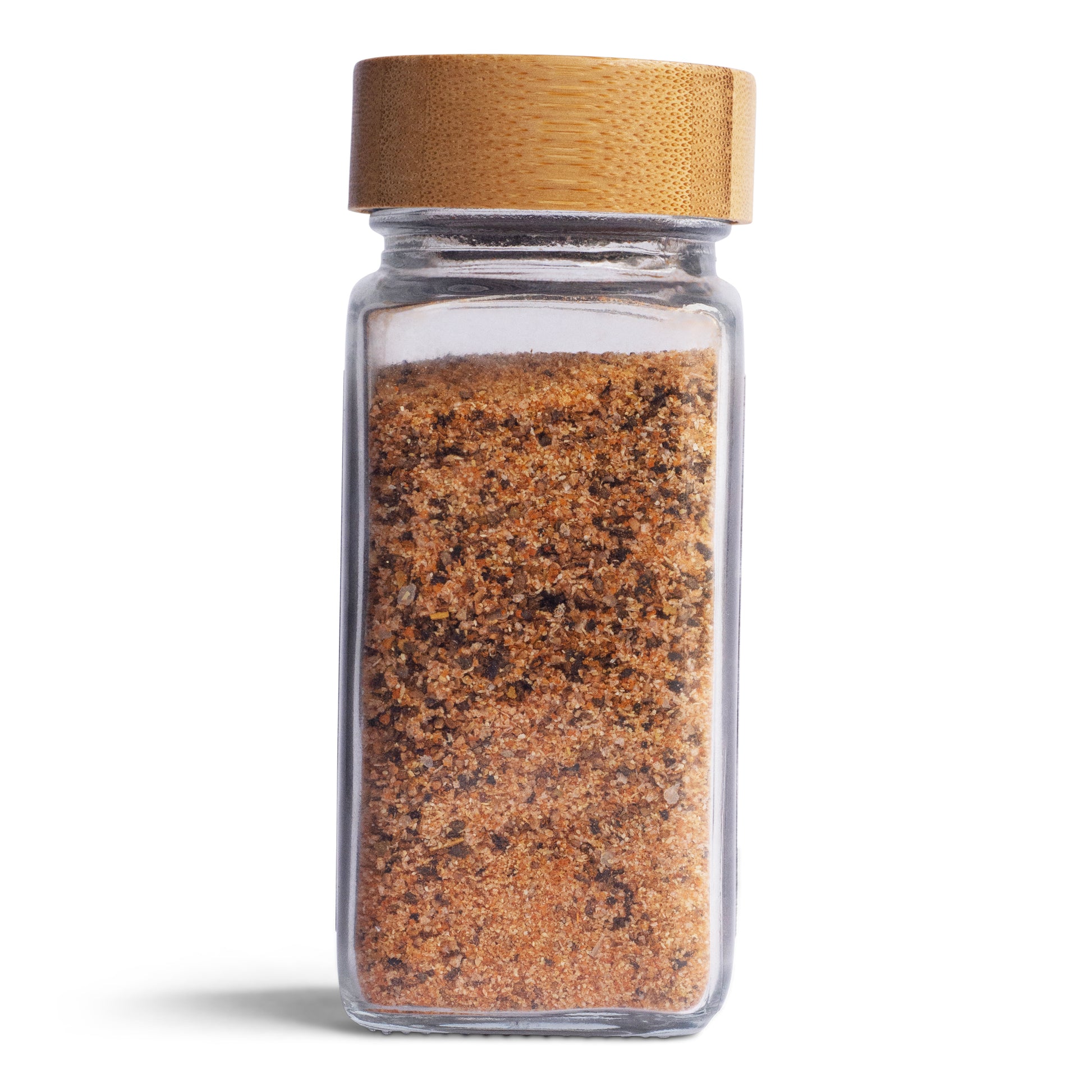 Tasty Tin garlic dust seasoning shaker with bamboo lid and glass container filled with brown spice