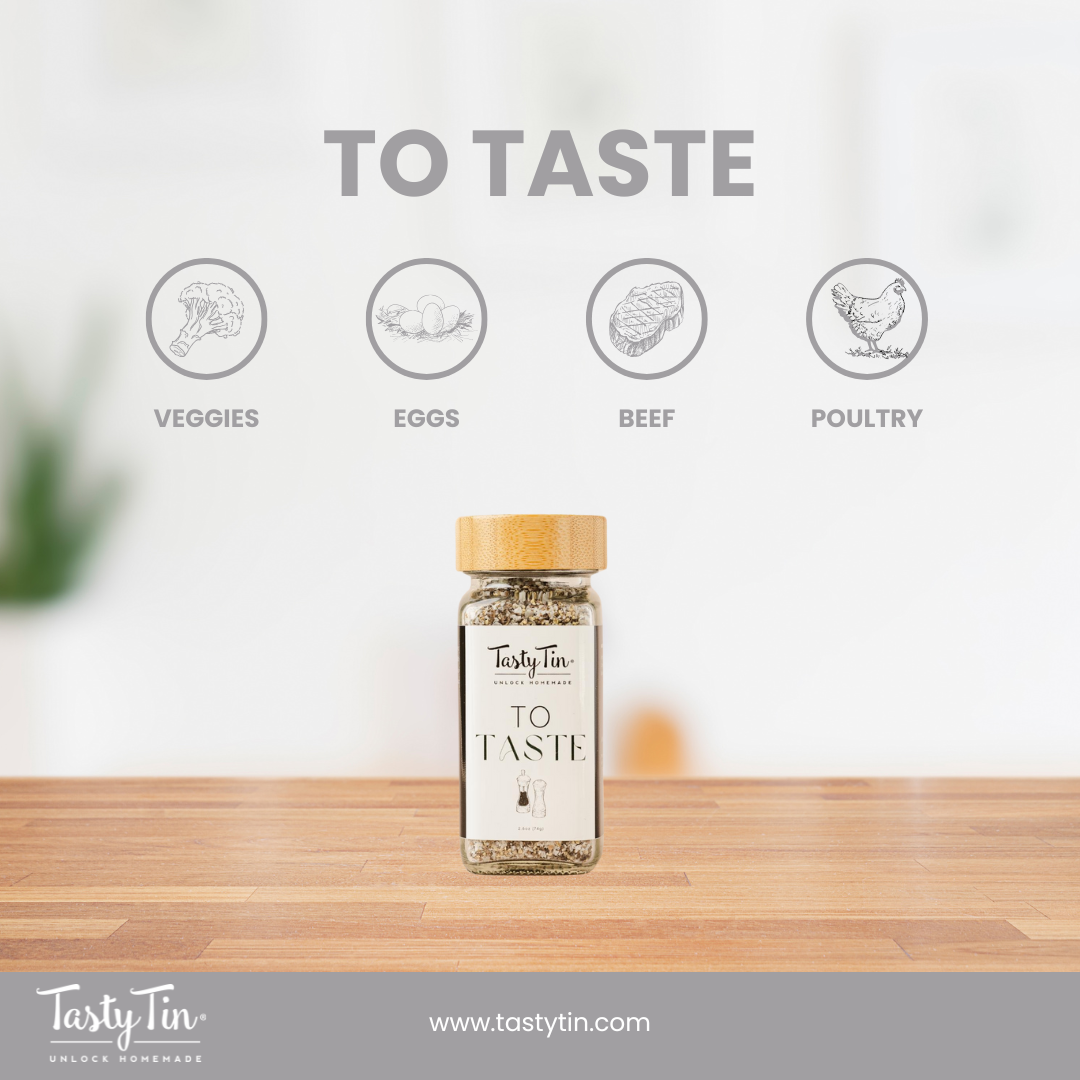 Tasty Tin gourmet seasoning shaker labeled To Taste with bamboo lid on wooden surface