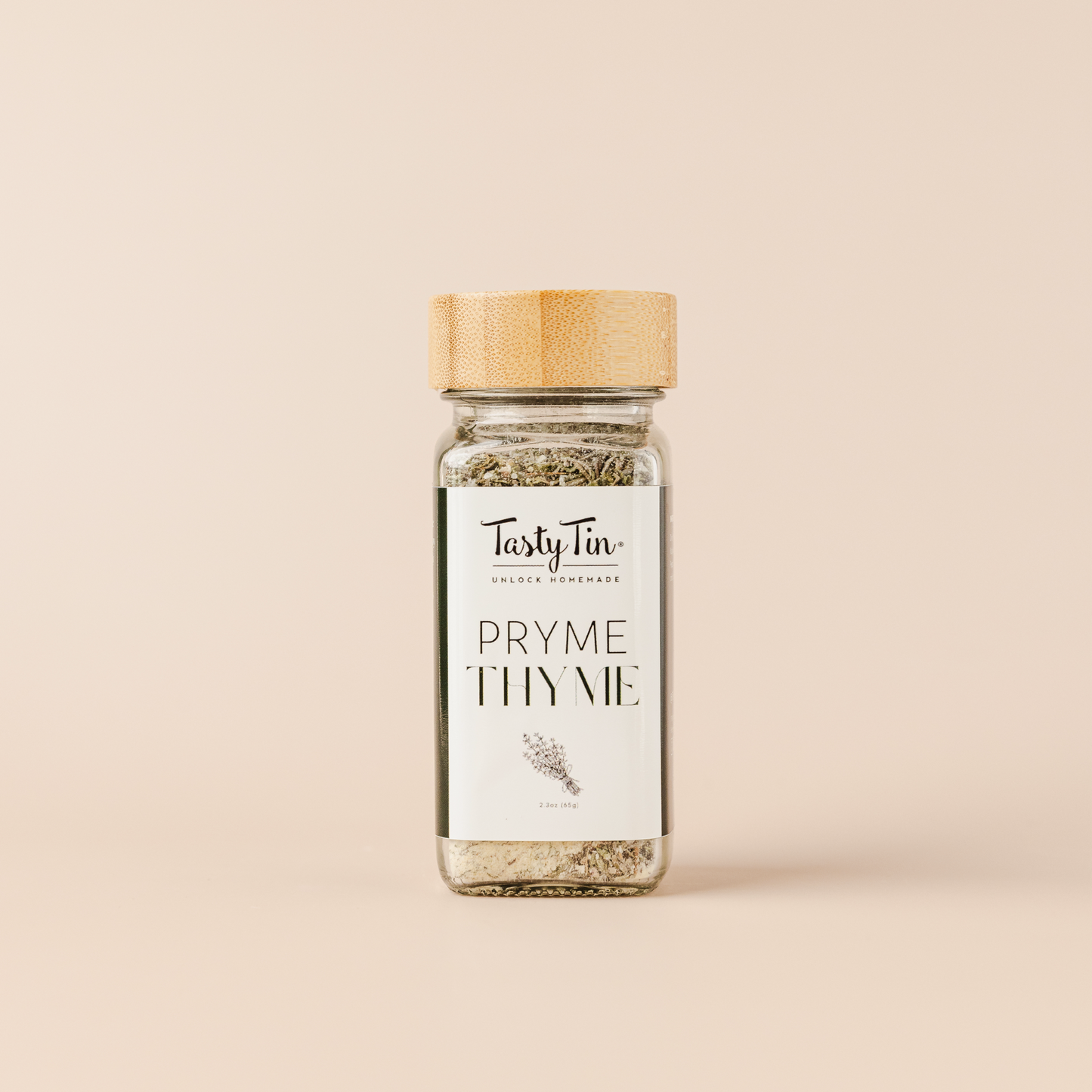 Tasty Tin thyme seasoning shaker with bamboo lid and clear glass jar filled with dried thyme